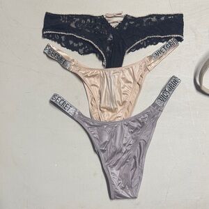 Victoria's Secret Three-Pack Thong Set in Black, Nude, and Gray